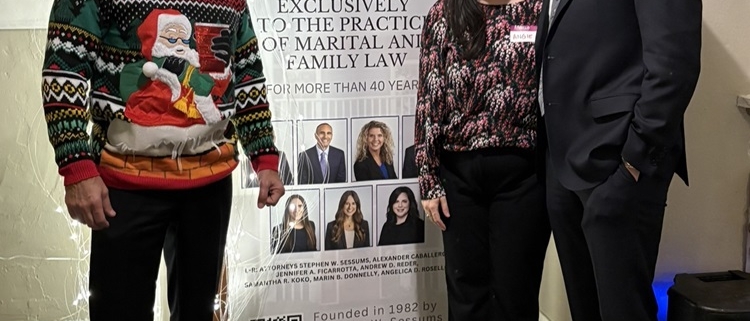 people in front of a banner posing for the camera